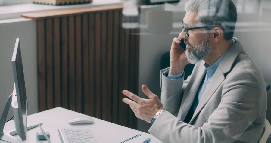 Corporate professional on a mobile phone call in a modern office